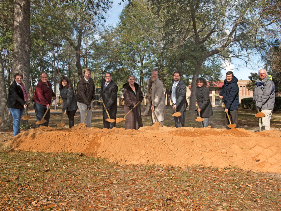 University officials with shovels posing at the Lab Sciences Annex groundbreaking