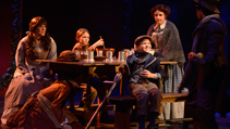 The Cratchit family around the table