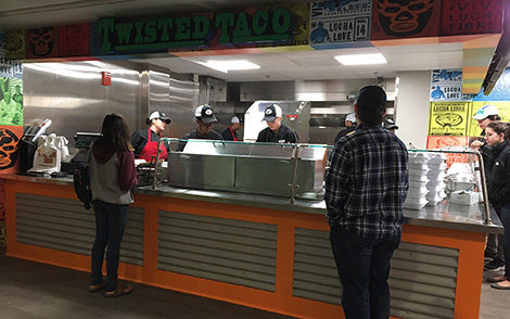 students waiting in line at twisted taco