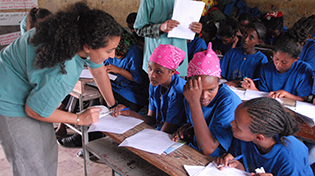 Volunteer leads class in African school.