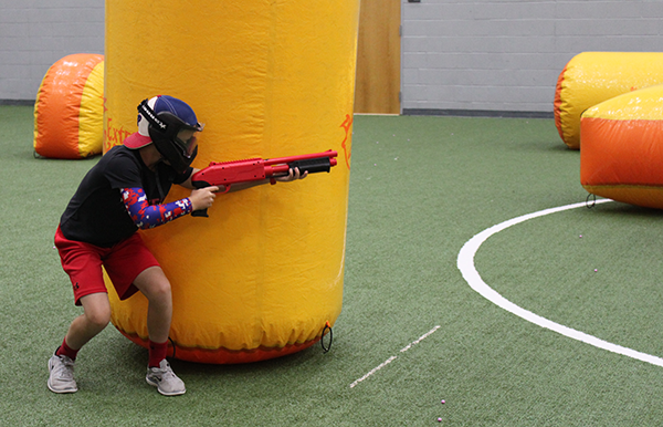 A participant playing paintball