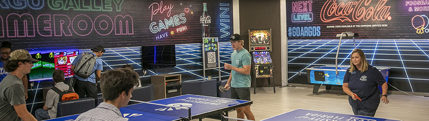 People playing ping pong in the Argo Galley Gameroom