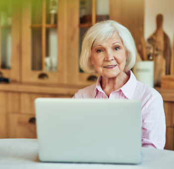 Elder woman looking at laptop