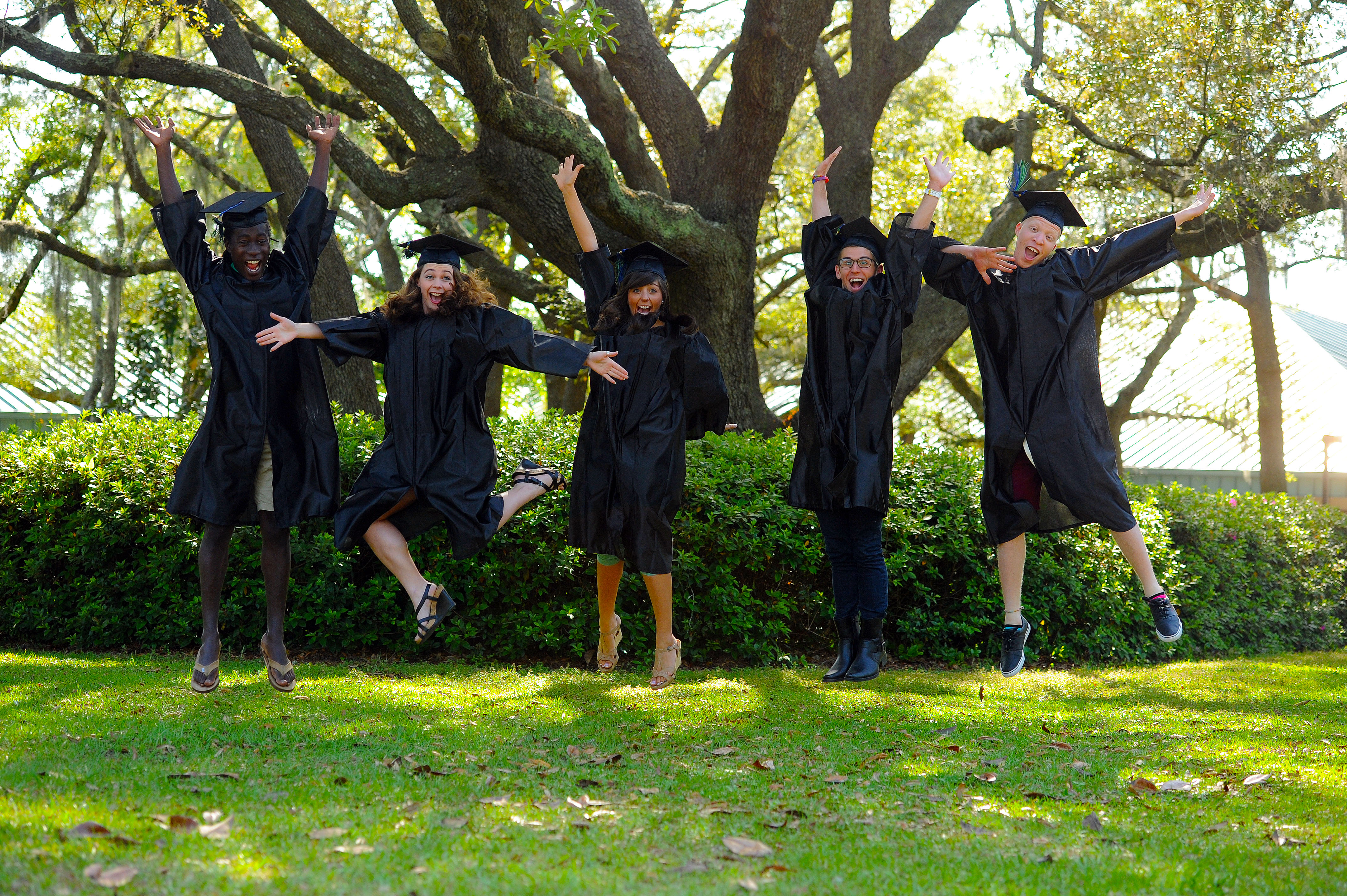 Graduating students jumping in celebration
