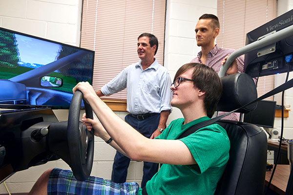 psychology students and faculty doing simulation lab tests