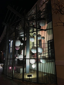 A contained sculpture of white spheres located in Downtown Pensacola
