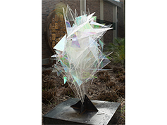 An outdoor art piece themed around coalescence, the joining or merging of elements to form one mass or whole.