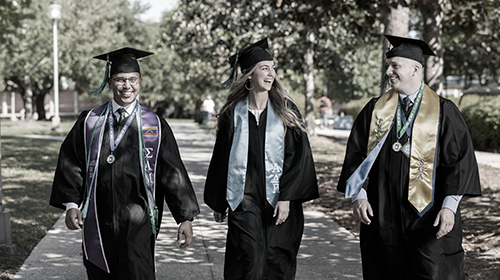 Graduates walking outside
