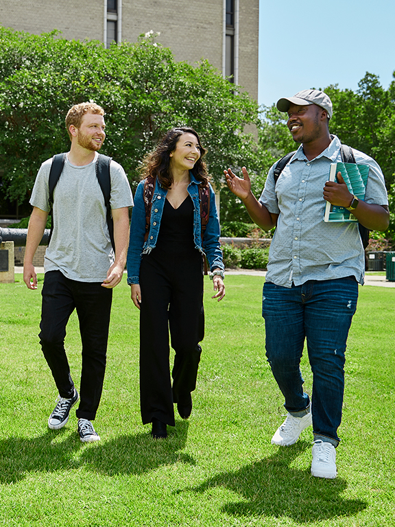 Students walking across the cannon green	