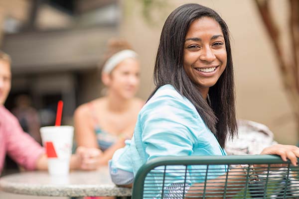 students outside on the commons patio