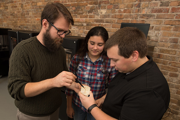 Students collaborating on a 3D print