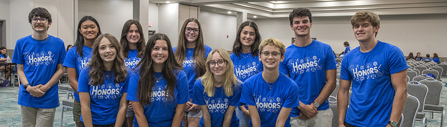 Students pose for a group photo in the conference center for honors orientation.