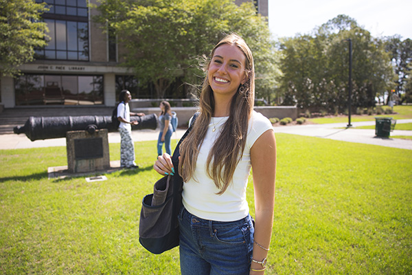 UWF Student Taylor Parry standing on the Cannon Green.