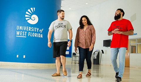 Student veterans walk through the HLS lobby.