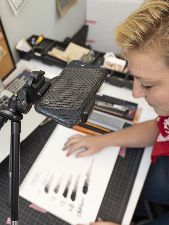 Kelly Leitermann, an adjunct in UWF's Department of Art and Design, engages in a remote-learning session from her home office with a University student.