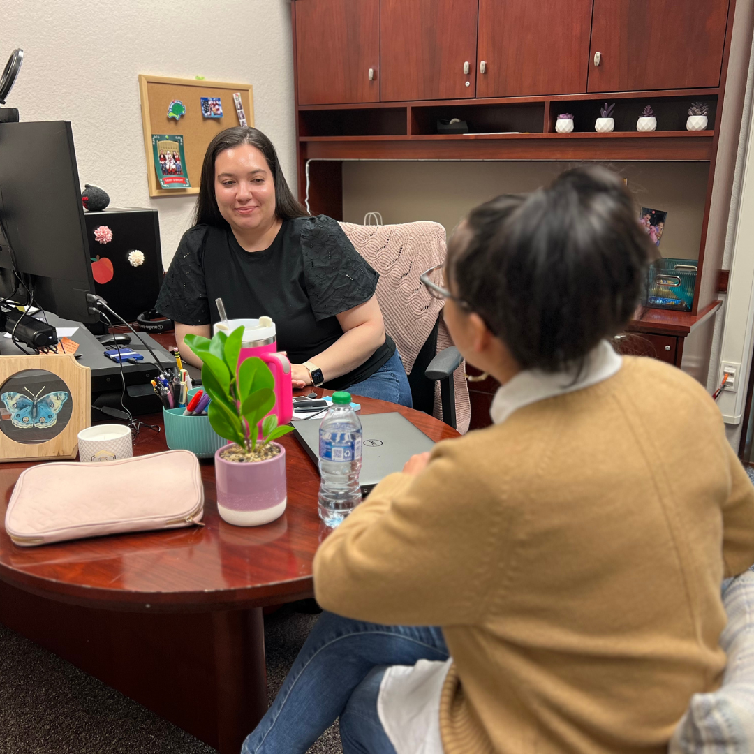 An instructional designer consults with a staff member about a multimedia project