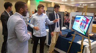 students presenting at conference