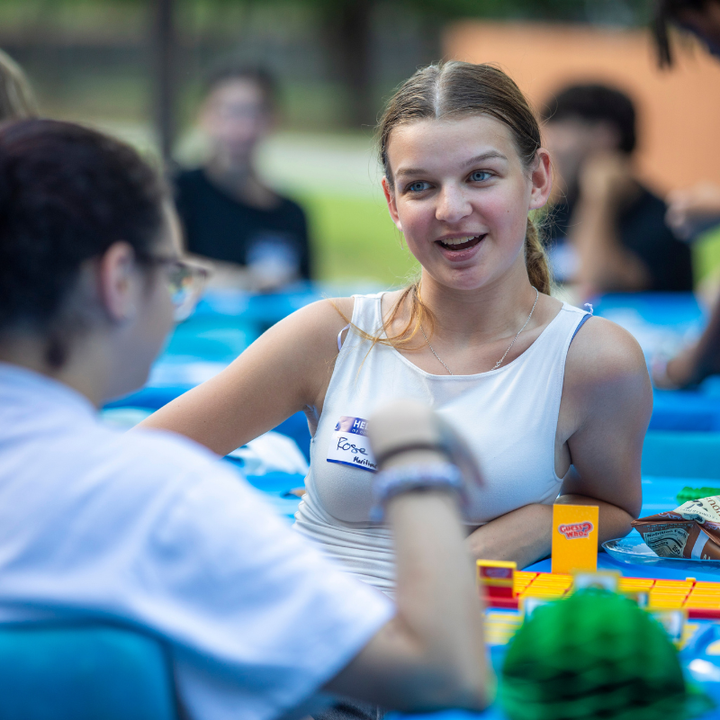 A student playing a game with another student at an ArgoFirst event.
