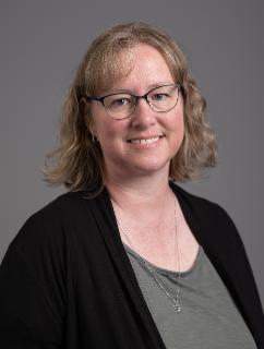 Professional headshot of Janell Russell against a neutral backdrop