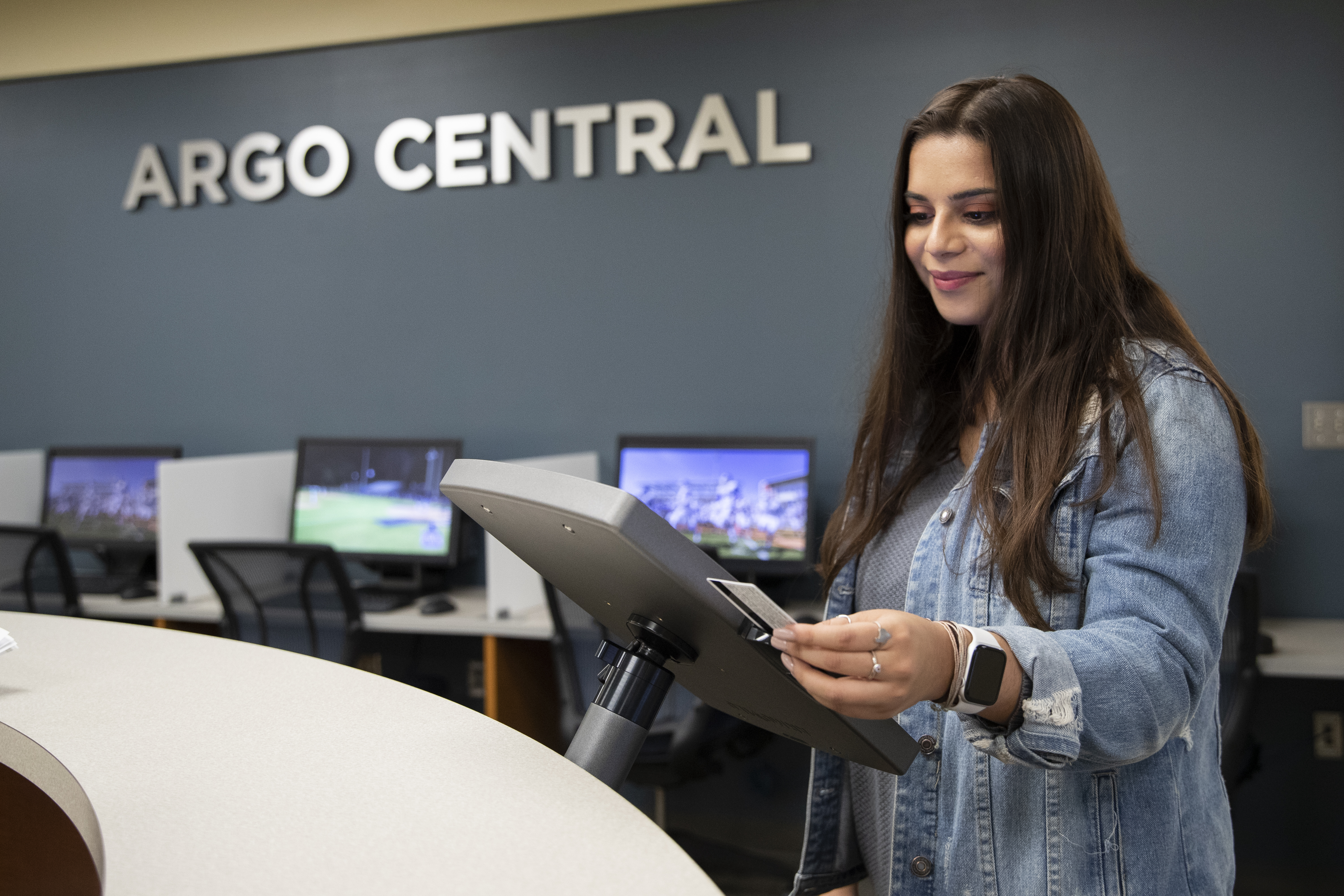 student checking into Argo Central Kiosk at Front Desk