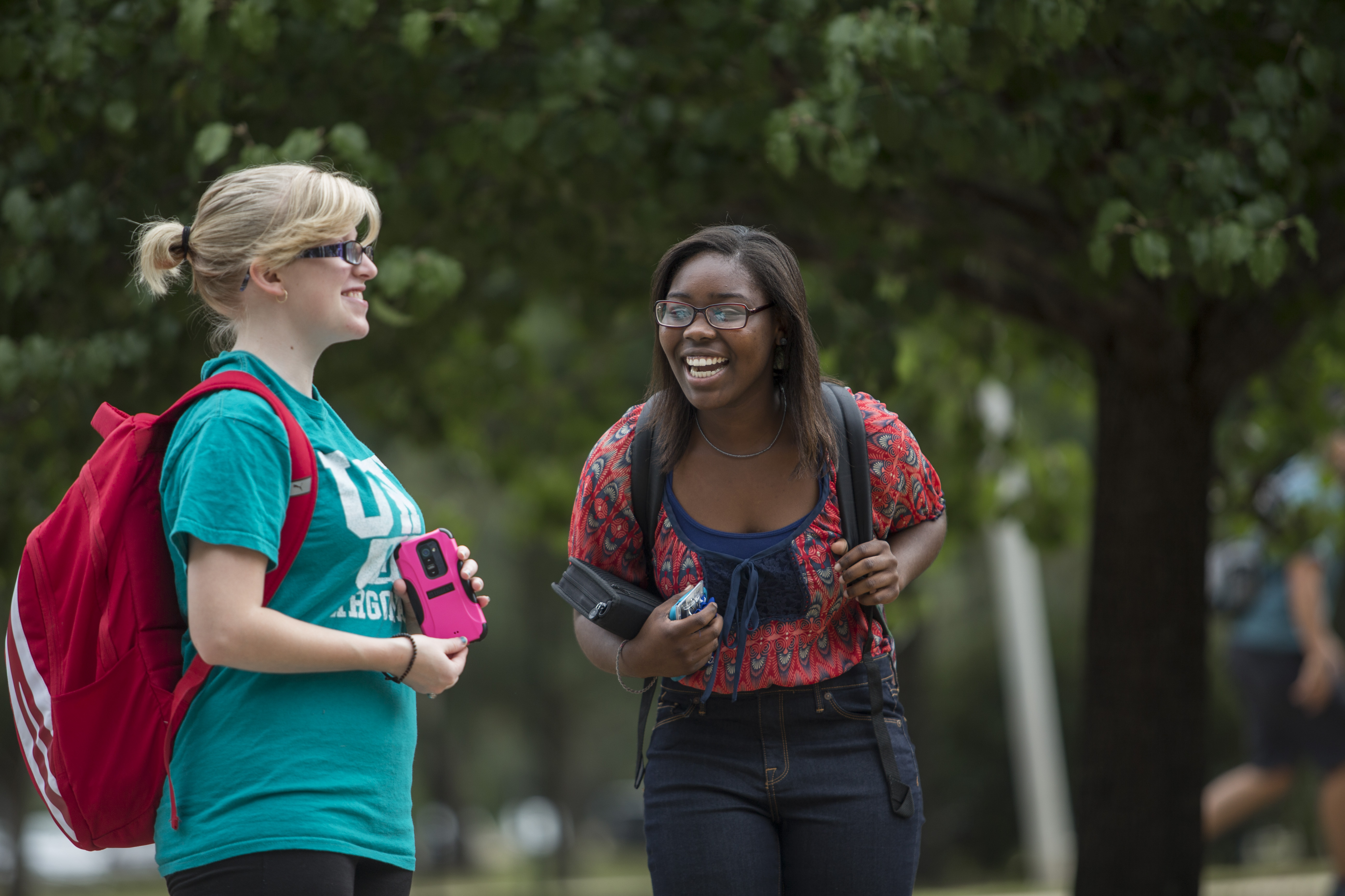 2 students talking to each other on campus