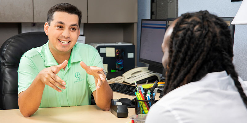 Advisor giving talking to student about schedule