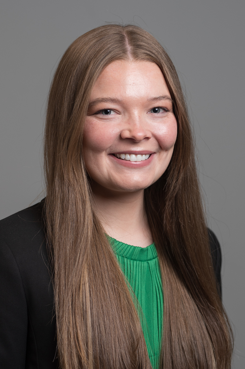 Professional headshot of Kylie against a neutral background