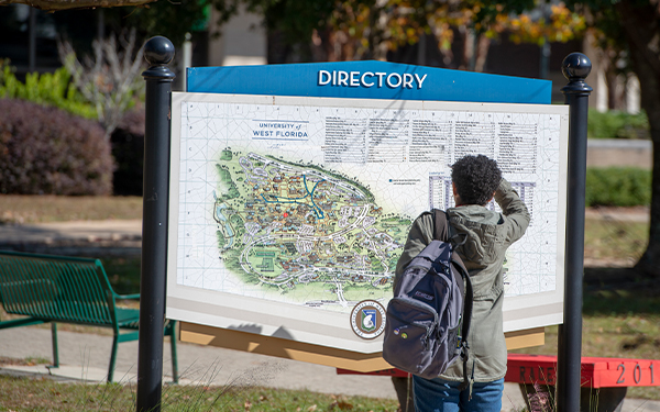 Students looking on University map