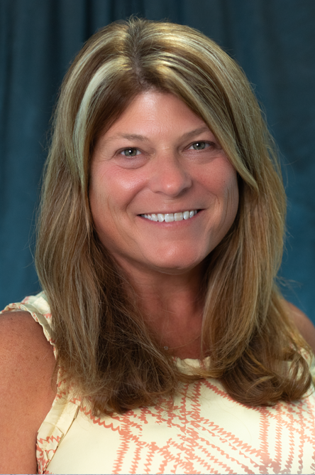 Dr. Melanie DiLoreto indoor headshot.