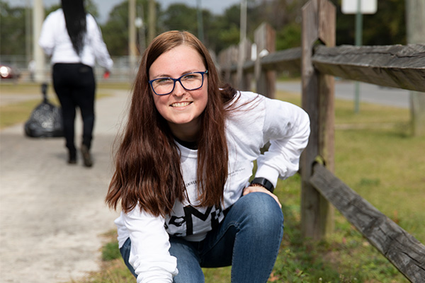 Female Student Volunteering at clean-up