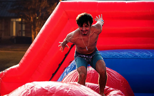 student on a inflatable slide