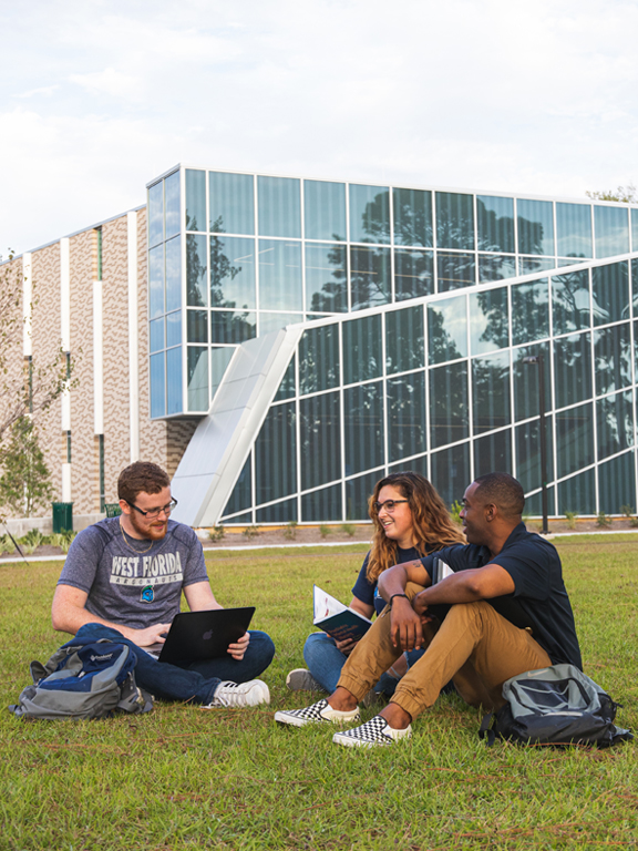 Students studying outside on UWF campus.