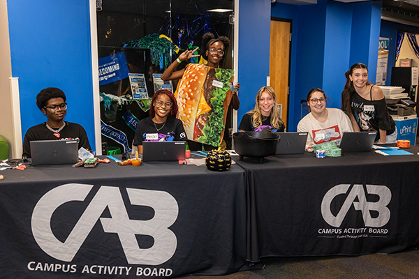 cab members at a sign-in table