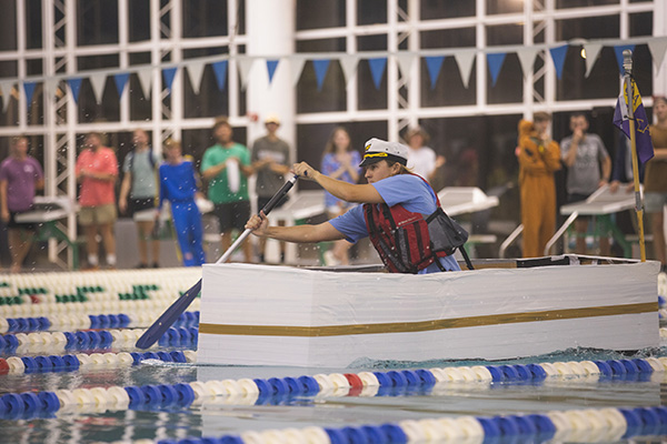 student racing a cardboard boat