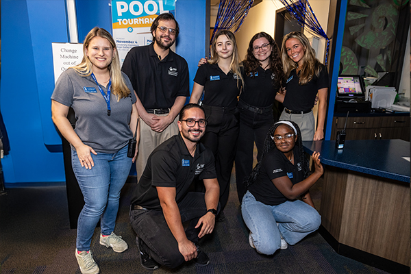 Students posing together at campus event