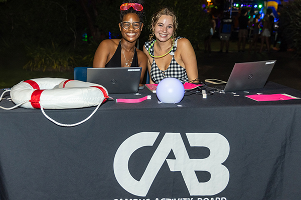 students at check in for cab event