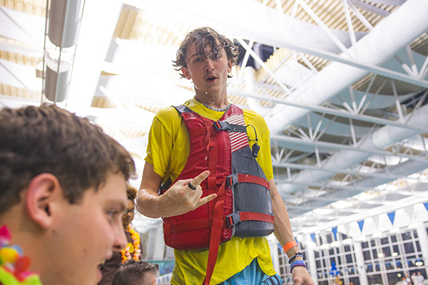 student wearing a lifejacket at the aquatic center