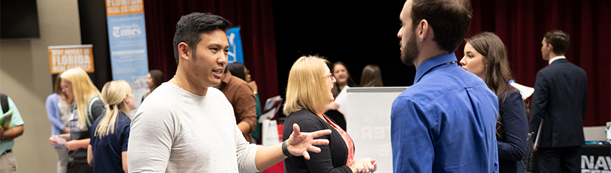 Student talking to an employer at a career event