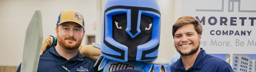 Two people posing with Argie