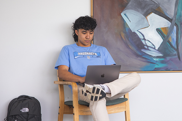 Student on laptop in common study area