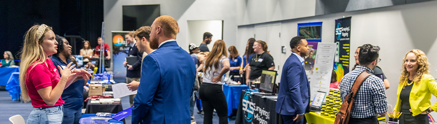 Students meeting employers at a career fair