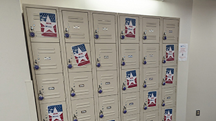 Beige lockers with flyers and locks on them