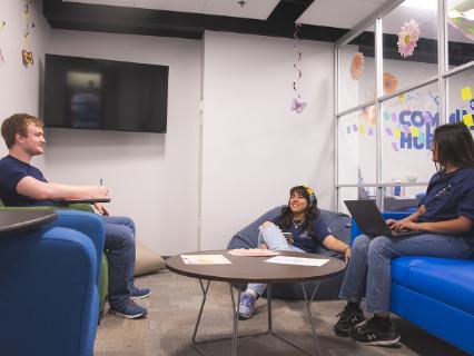 Three students in the Commuter Hub