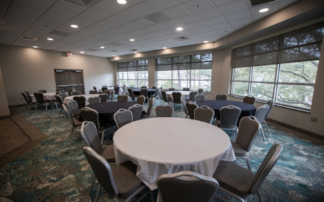 The Conference Center Lounge with round tables and chairs cropped to a thumbnail