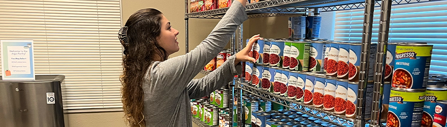 Student browsing the argo pantry shelves