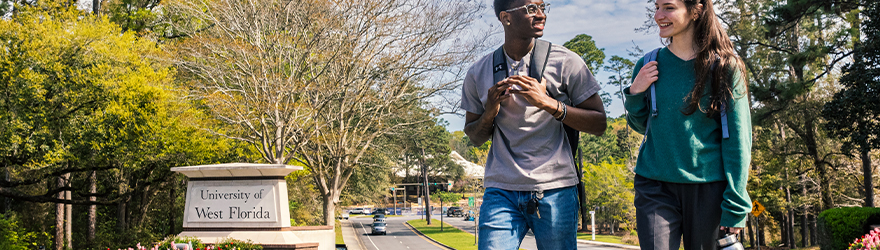 Students walking in front of UWF entrance