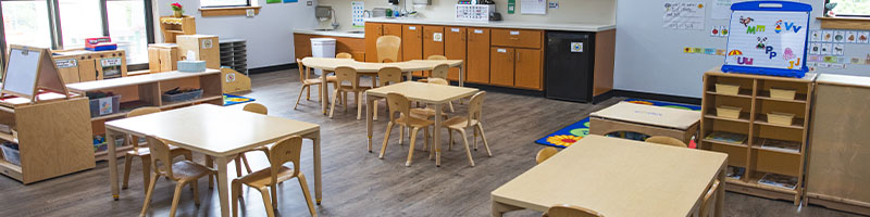 classroom with table, chairs and activities