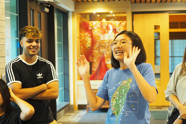 student engaging with other students on campus
