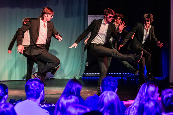 students performing at homecoming court pageant
