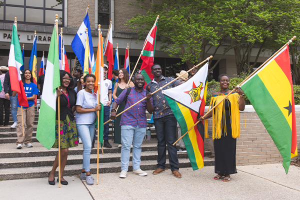 students standing with global flags
